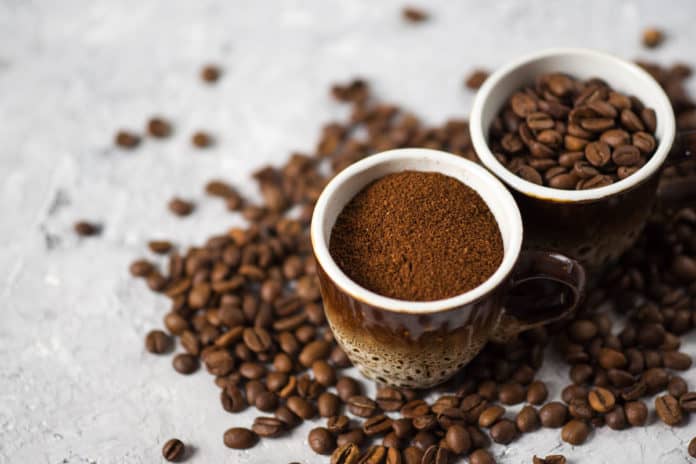 Coffee beans in coffee cups on a table