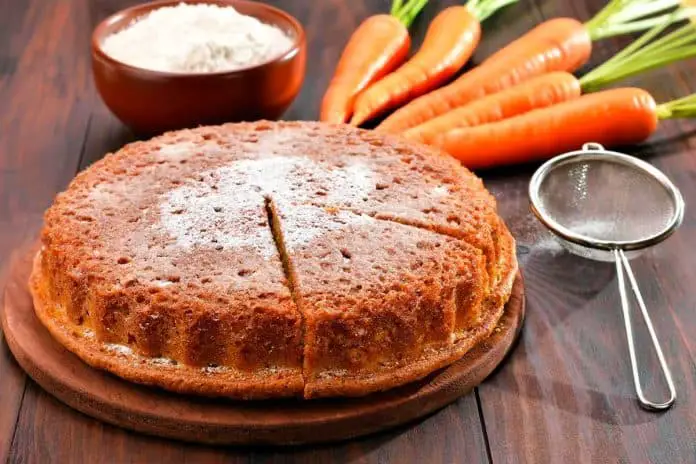 A carrot cake on a wooden table
